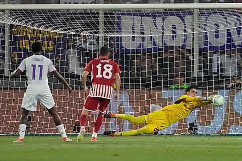 Olympiacos' goalkeeper makes a save